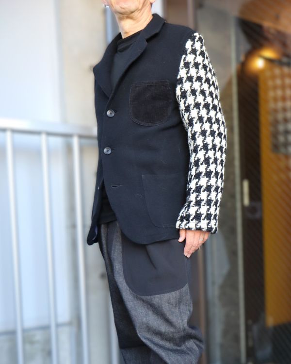 エイチマウント、メンズ ウールジャケット 着用写真。フロントボタンとポケット、袖の千鳥柄がわかる立ち姿。